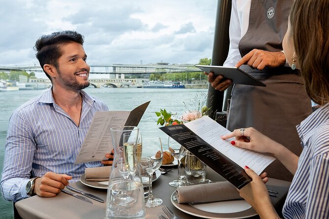 Bateaux Parisiens Seine River Gourmet Lunch & Sightseeing Cruise - Boarding beneath the Eiffel Tower