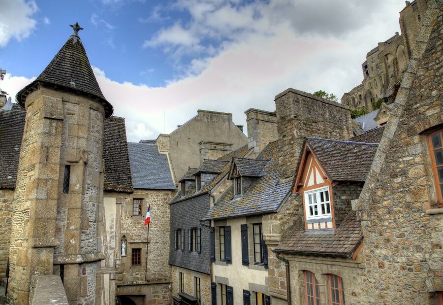 From Paris: 2-Day Normandy & Brittany Tour - Mont Saint-Michel and the Abbey climb