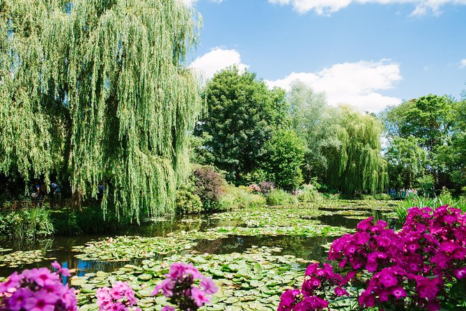 From Paris: Monet Gardens & Giverny Bike Tour with Picnic Stop - Giverny’s church, cemetery, and Hotel Baudy