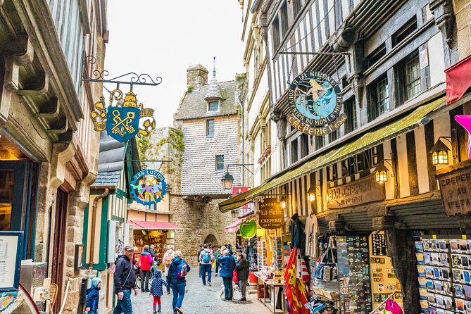 Mont Saint Michel Day Trip from Paris with English Speaking Guide - Arriving by shuttle or on foot