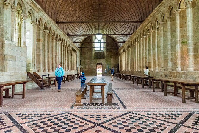 Mont Saint Michel Day Trip from Paris with English Speaking Guide - Climbing the medieval village to the abbey
