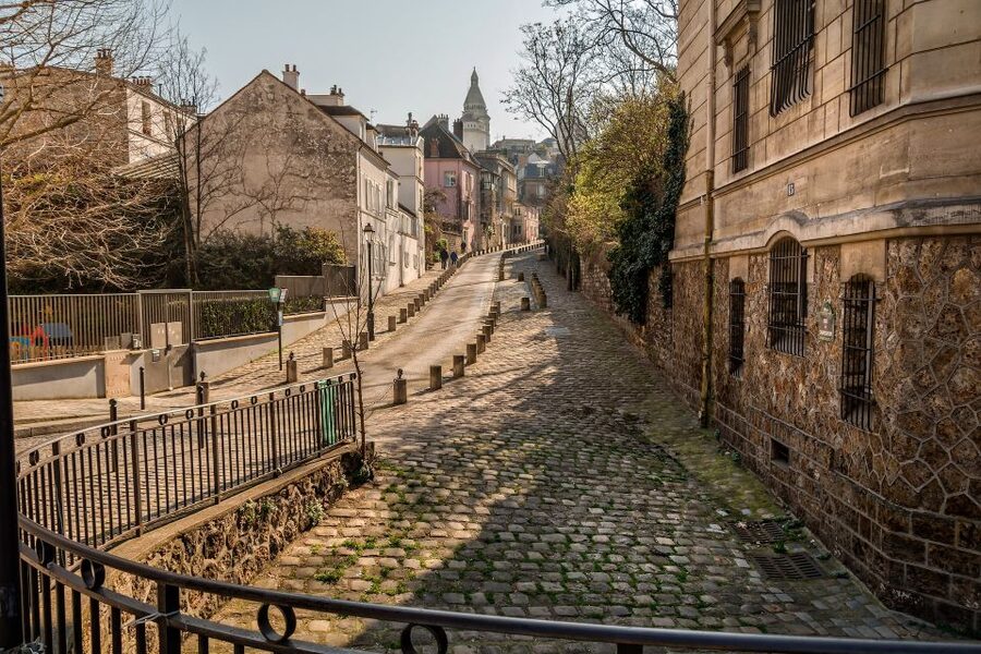 Paris: Charms of Montmartre Guided Walking Tour - Starting beneath the Moulin Rouge lights