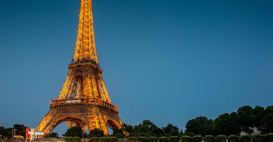 Paris: City Tour by Bus with Eiffel Tower & Optional Summit - The illuminated Louvre and Champs Elysées