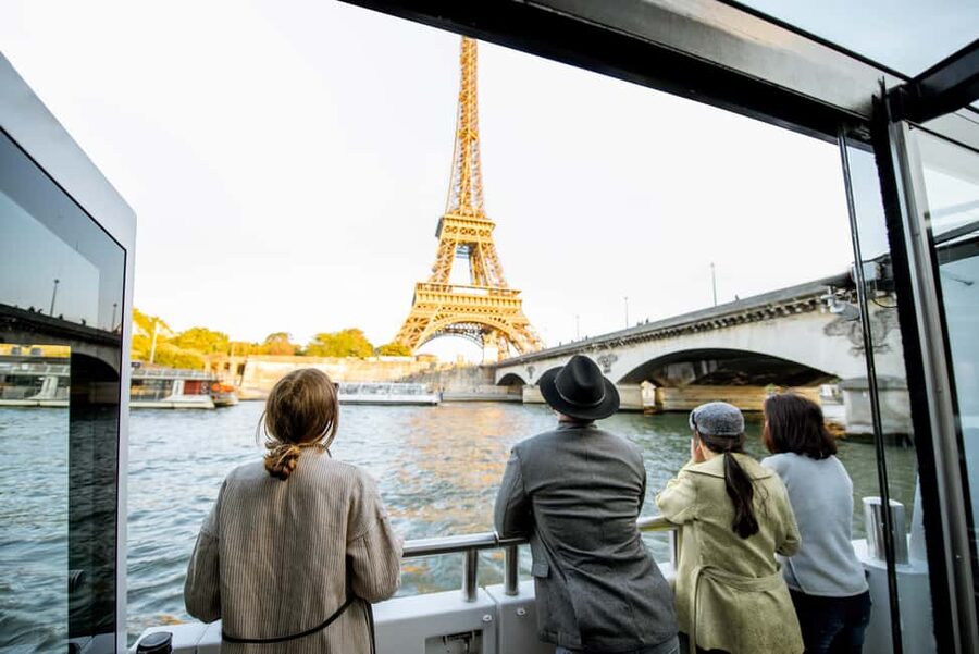 Paris: Eiffel Tower Tour & Seine River Cruise Tour - Hearing the story of the Iron Lady