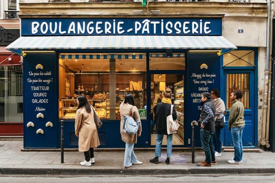 Paris: Gourmet Food Tour with Over 10 Tastings and Wine - A French meal that begins on the pavement