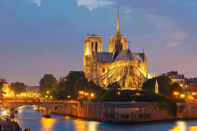 Paris Lights Evening Bus Tour with Eiffel Tower Summit Option - Paris after dark, viewed from a moving coach