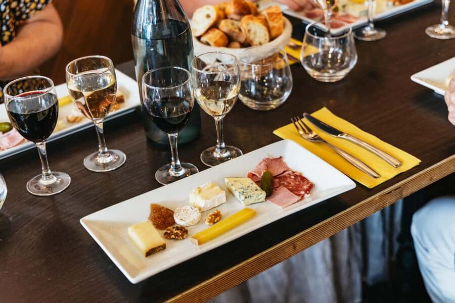 Paris: Montmartre Cheese, Wine & Pastry Guided Walking Tour - Savory stops with cheese, charcuterie, and wine