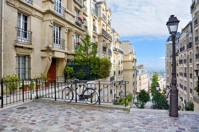 Paris: Montmartre Hidden Gems and Highlights Walking Tour - Climbing toward Sacré-Coeur
