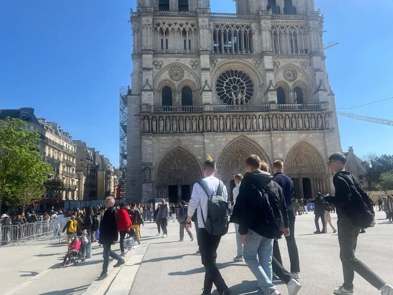Paris: Notre-Dame Cathedral Exterior Tour & Free Entrance - Understanding the 2019 fire and restoration
