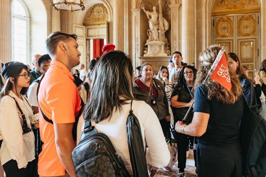 Versailles: Skip-the-Line Tour of Palace with Gardens Access - Entering the palace through the group entrance